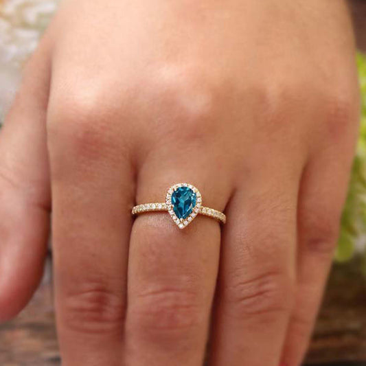 Halo design Pear shaped gemstone 925 sterling silver ring with mini stones at border, available in many stone variation