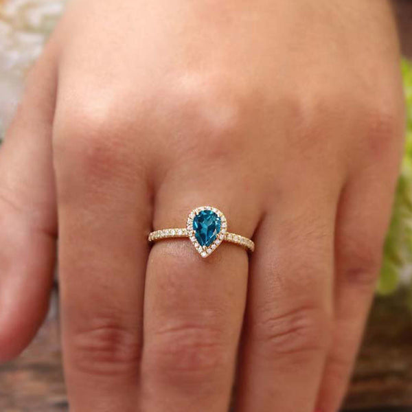 Halo design Pear shaped gemstone 925 sterling silver ring with mini stones at border, available in many stone variation